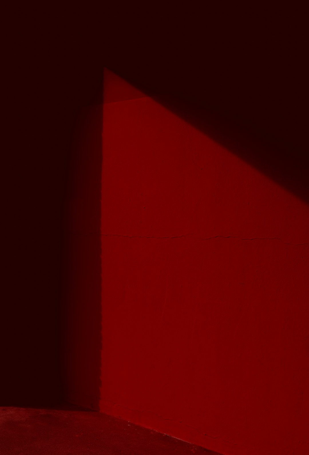 a-person-sitting-on-a-bench-in-a-dark-room-6fe34tjix4k